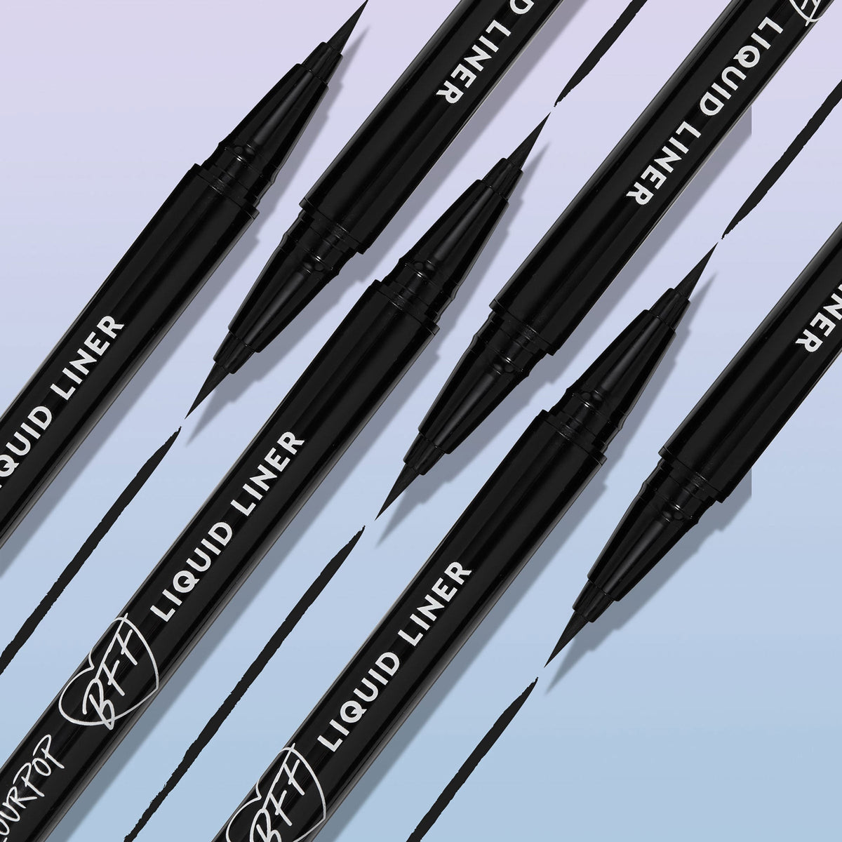 ColourPop BFF Liquid Liner in Black, brush-tip pen drawing sleek, ultra-pigmented lines, with multiple pens angled diagonally and inky strokes on a soft gradient background - ideal for precise wings and long-wear eyeliner looks.