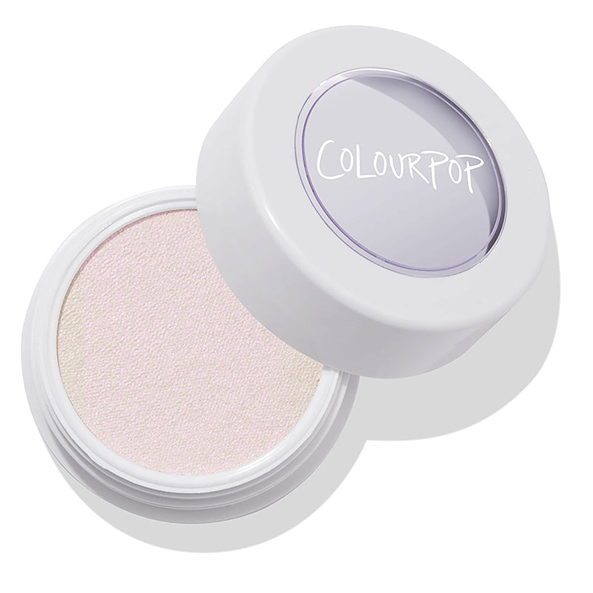 ColourPop Monster Super Shock Highlighter opens in a white round pot with a clear ColourPop lid, revealing an iridescent pale pink-lavender shimmer pan, set at an angle on a white background with a soft shadow.