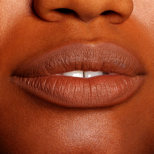 Lips wearing BFF3 ColourPop Lippie Pencil, lining and filling the mouth in a warm brown nude shade with a smooth, non-glossy finish; tight close-up swatch on lips highlighting precise color payoff and definition.