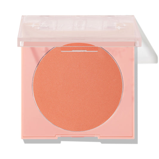 Shortbread pressed powder blush compact displaying a warm peach pan in a pale pink square case with a clear lid half closed, ColourPop Pressed Powder Blush shown on a clean white background.