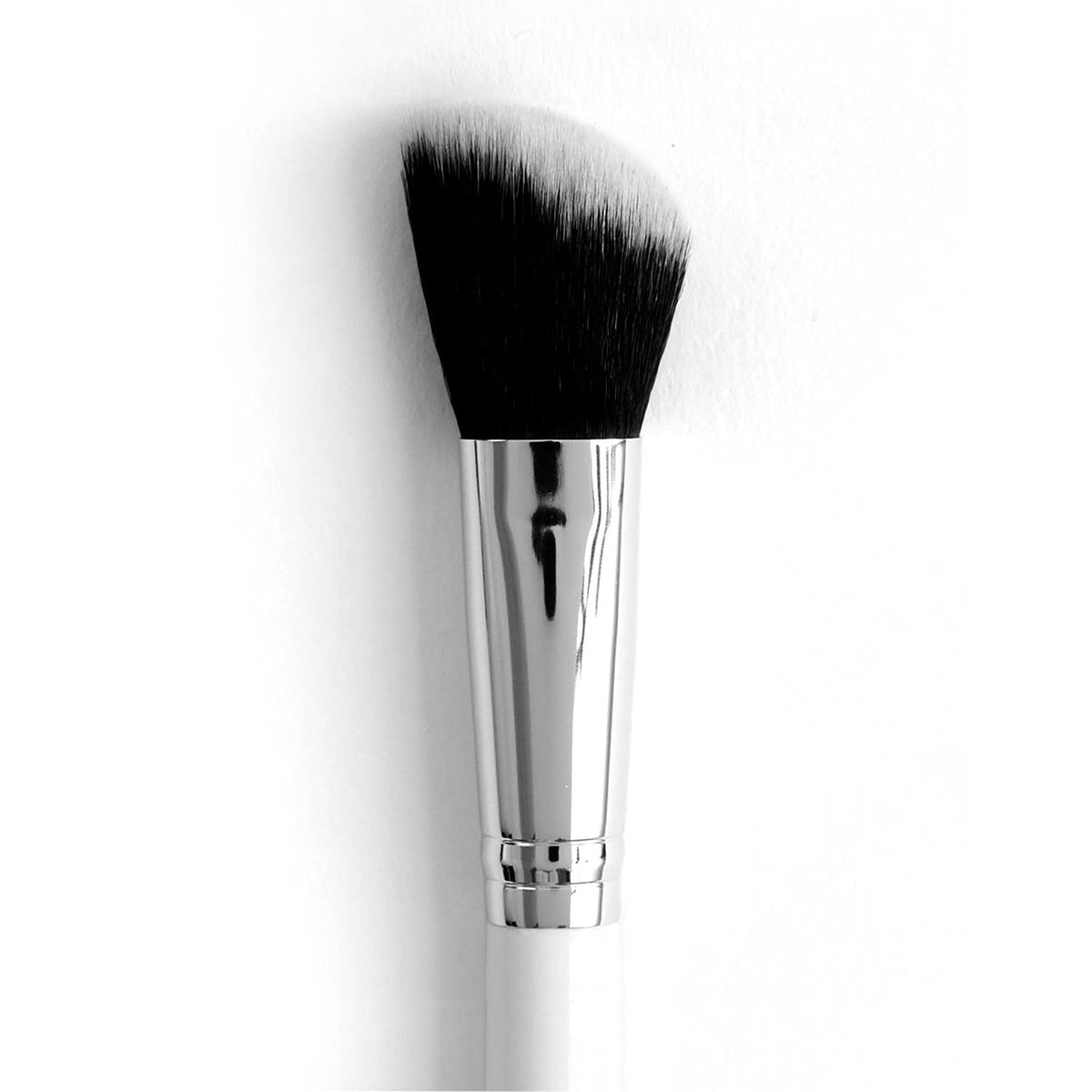 Angled Face Brush blending and contouring with soft black-to-white bristles, chrome ferrule, and white handle, shown on a clean white background; versatile makeup brush ideal for applying ColourPop blush, bronzer, and highlighter.