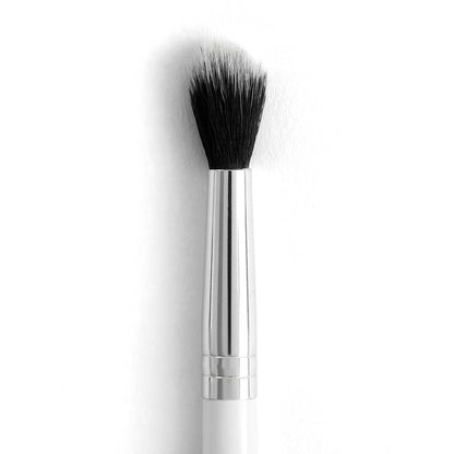 ColourPop Tapered Blending Brush makeup brush diffusing eyeshadow with soft, tapered black synthetic bristles; sleek silver ferrule and white handle shown close up on a white background, ideal for crease work and seamless blending.