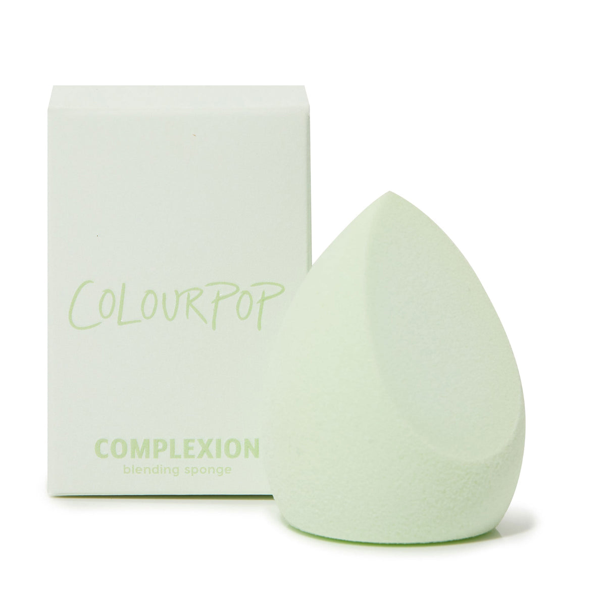 Mint green teardrop Complexion Blending Sponge standing upright beside its ColourPop box, featuring a pointed tip and flat edge for seamless foundation and concealer application; ColourPop Makeup Tools & Accessories.