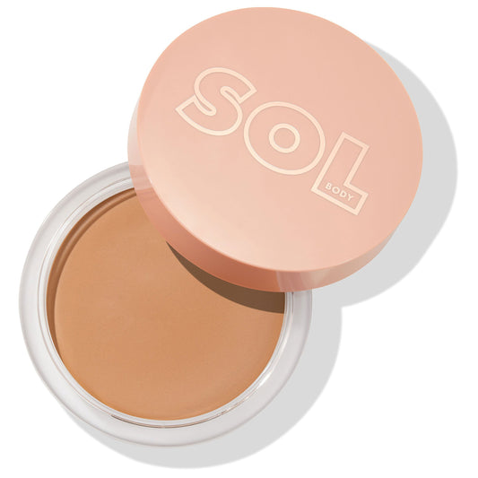 Open compact showing the Light shade of ColourPop SOL Face & Body Bronzing Balm, a smooth cream bronzer in a round clear jar with a peach SOL Body lid, ready to deliver a natural sun-kissed glow to face and body.