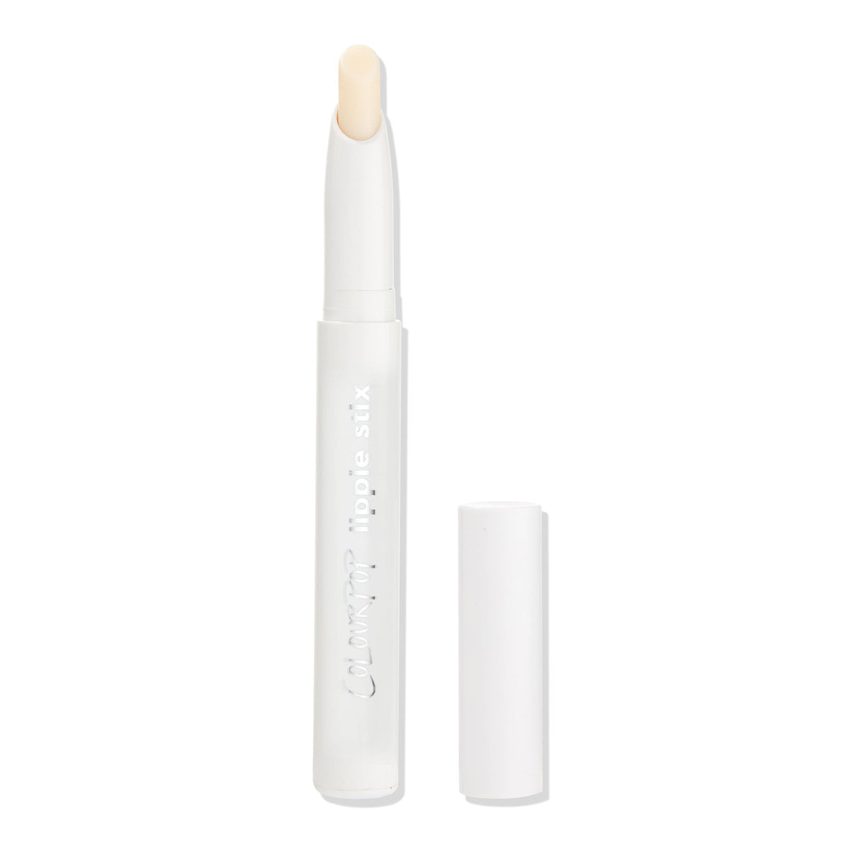 ColourPop Lippie Stix Primer standing uncapped, twist-up transparent balm exposed in a slim white tube with silver logo, cap beside it on a clean white background, prepping lips for smooth, long-wear color.