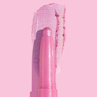 Juicy Gossip Shadow Stix glides a metallic bubblegum-pink swatch across a pastel pink background, showcasing the creamy, shimmery payoff of the ColourPop Shadow Stix twist-up eyeshadow stick.