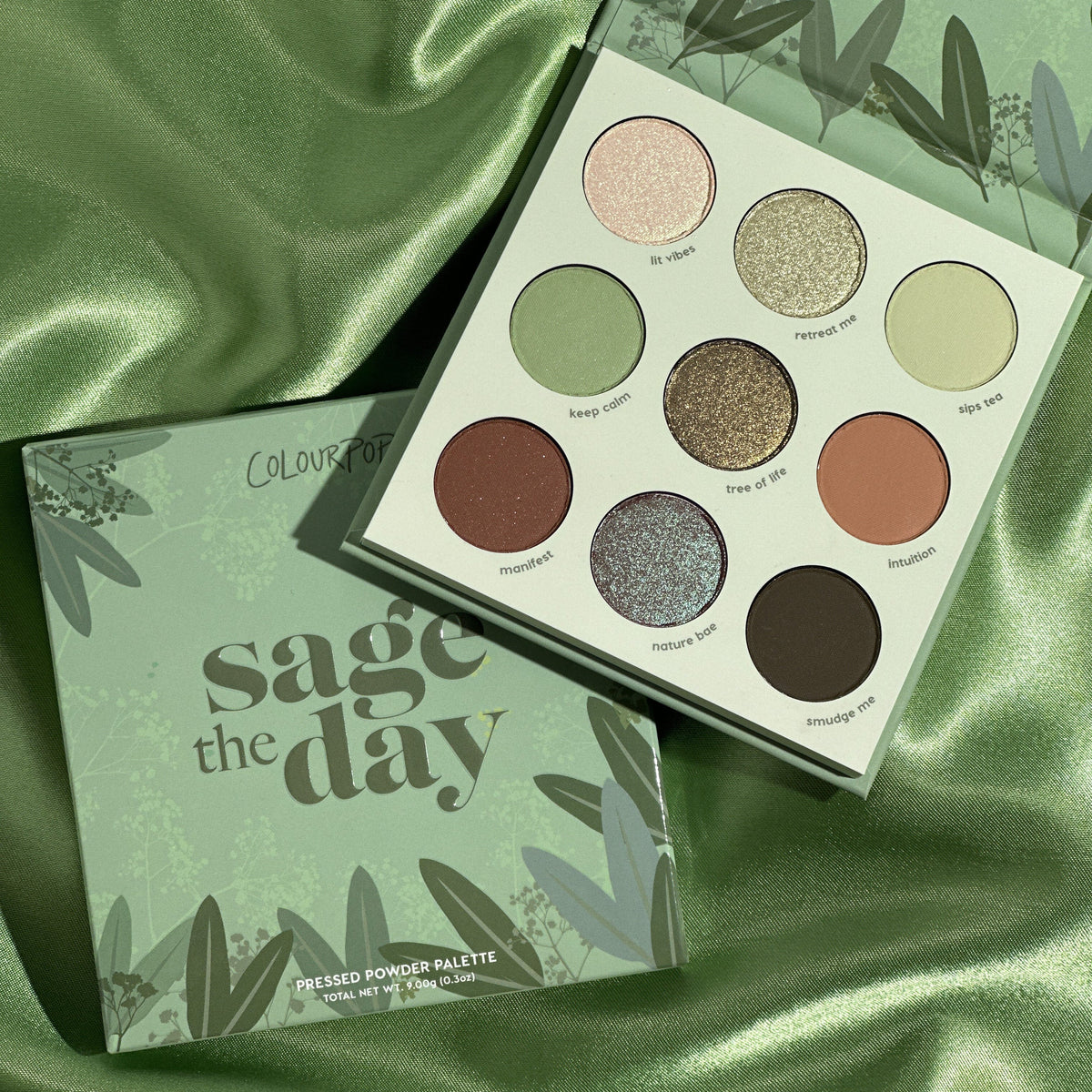 ColourPop Sage The Day pressed powder shadow palette opens to nine pans - sage greens, earthy browns, and shimmering golds - in matte and shimmer finishes, displayed on green satin beside its box; a ColourPop Shadow Palette.