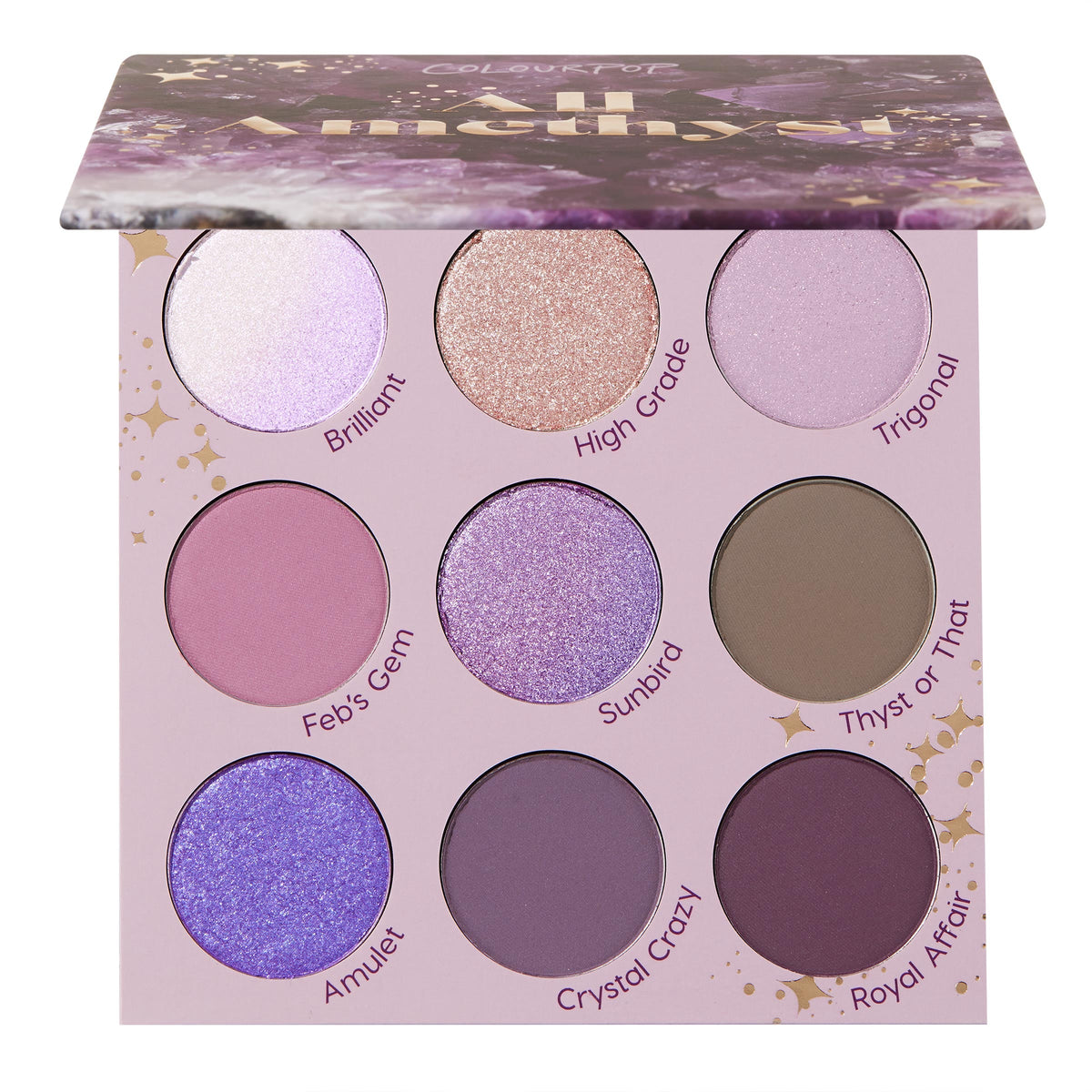 All Amethyst ColourPop Shadow Palette opens to display nine purple-toned shades - lilac, mauve, plum, taupe - in matte and shimmer finishes, with labels like Brilliant, High Grade, Amulet, beneath a half-open crystal-print lid on a pink tray with gold stars.