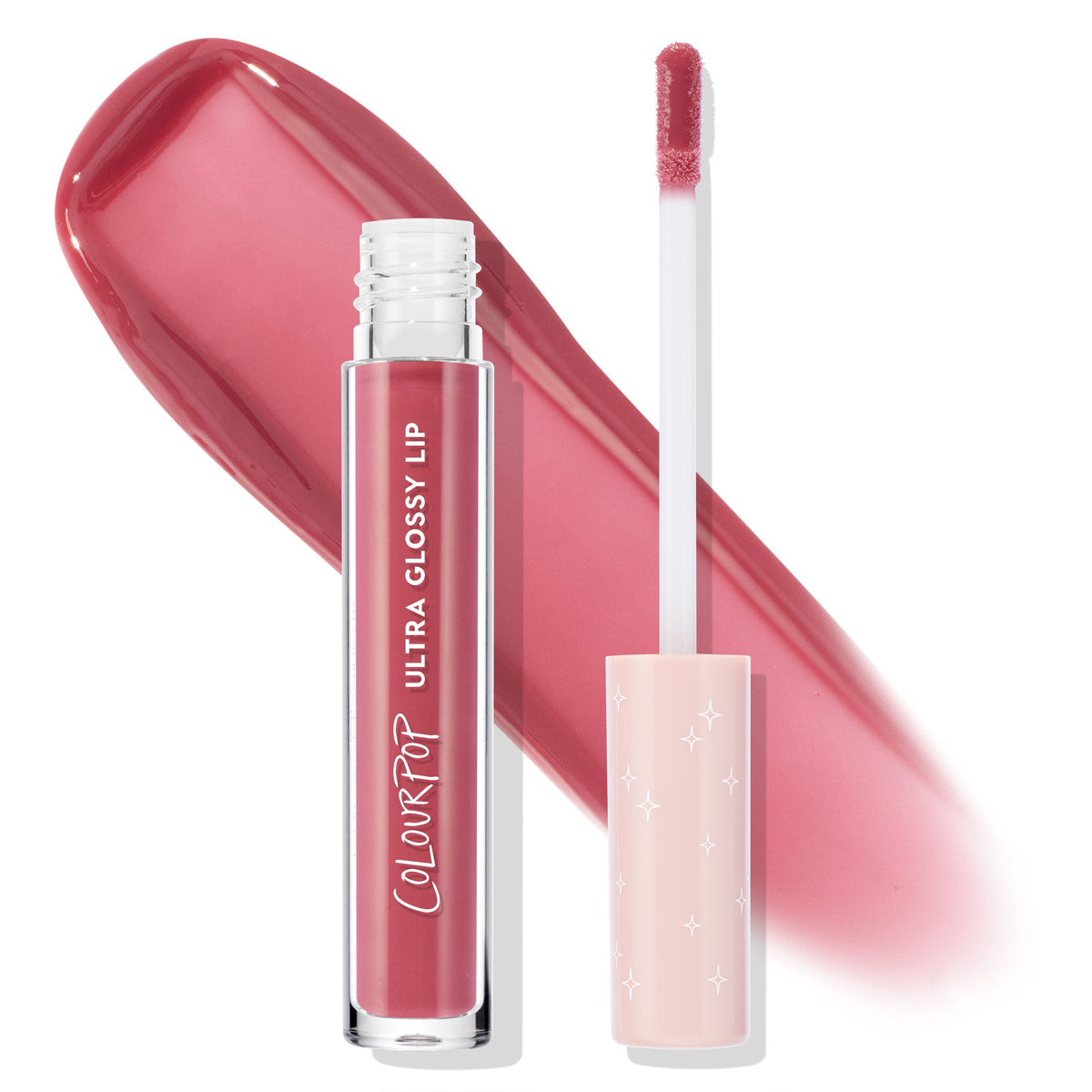 ColourPop Ultra Glossy Lip in All Me stands open with a doe-foot applicator and star-printed blush cap beside a wide rosy pink swatch on a white background, showcasing the high-shine mauve gloss in a clear tube.