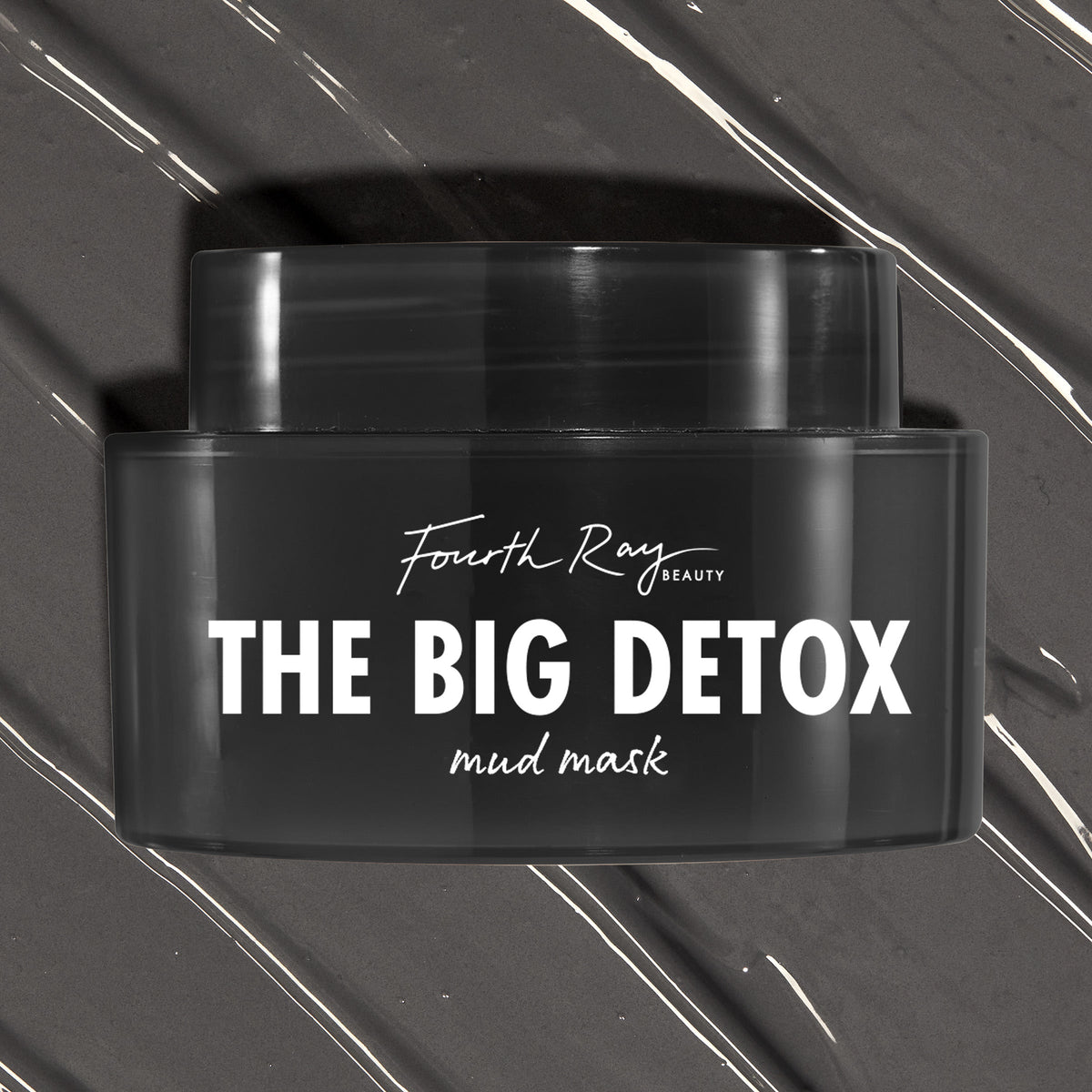 Black Fourth Ray Beauty The Big Detox Mud Mask jar displayed in a close-up flat lay, the ColourPop Face Mask resting on swirled charcoal mud with white streaks, showcasing the sleek container and bold white logo for detoxifying skincare.