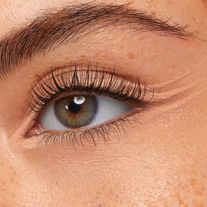 ColourPop Crème Gel Liner in Honeydude lines the lower waterline and inner corner, defining a hazel eye with a creamy nude‑beige finish; close-up shows long lashes and natural skin texture to showcase shade payoff and wear.