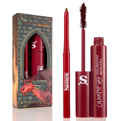 Dragon’s Keep Crème Gel Liner twisting up with a shimmery gold tip, shown uncapped beside a Shrek-themed castle box with dragon art and a matching red mascara; ColourPop Crème Gel Liner in red packaging with white logos.