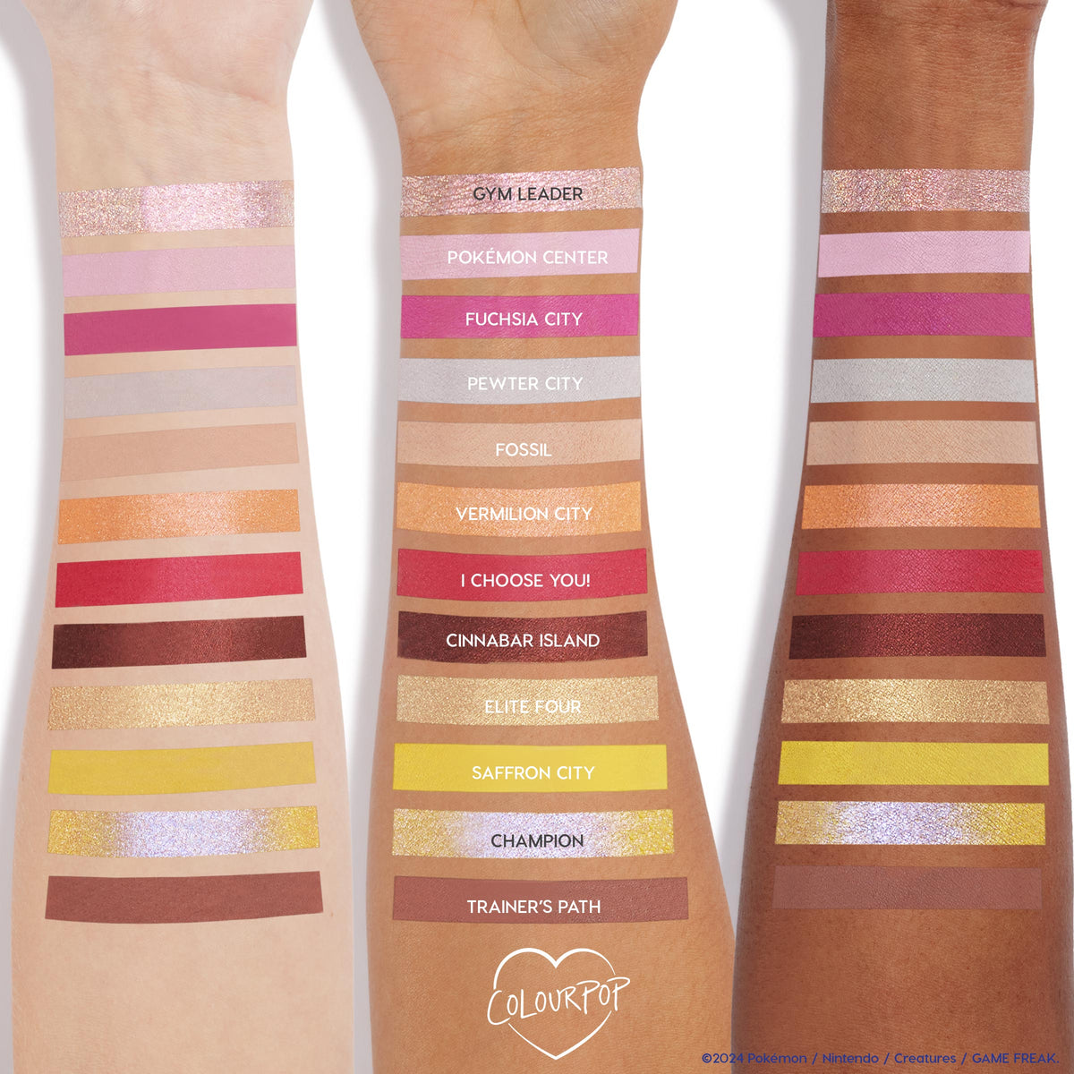 Swatched shades from the Partner Up ColourPop Shadow Palette & pH Lipstick Set stripe three forearms, showing pinks, neutrals, golds, yellow and duochrome shimmers like Gym Leader and Saffron City, demonstrating payoff across skin tones.
