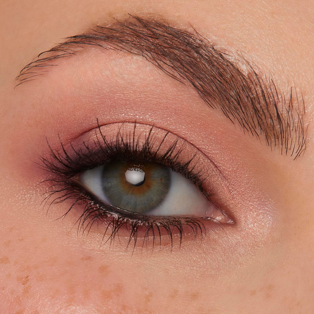 Light green-hazel eye flaunts peachy-pink shimmer with soft plum smoke and defined lashes, showcasing Coconut BB ColourPop Shadow Palette Set; close-up highlights seamless blend and subtle glow for an everyday neutral look.