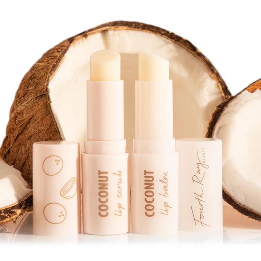 Coco Kisses ColourPop Lip Care Set displaying coconut lip scrub and lip balm in pale pink twist-up tubes with caps off, standing side by side in front of cracked coconut halves, with Fourth Ray Beauty branding on the caps.