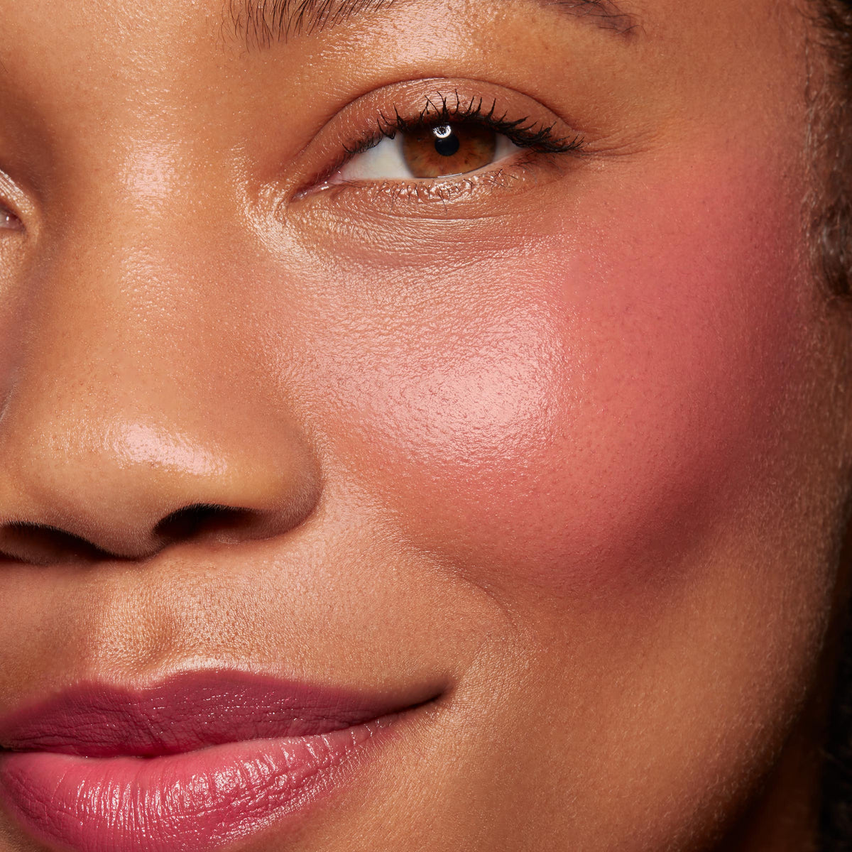 dewy pink flush on cheek and tinted lips using ColourPop Lip and Cheek Balm, shade Girls Night, showing creamy, buildable pigment and natural glow; close-up on model’s cheekbone and lips under soft studio light