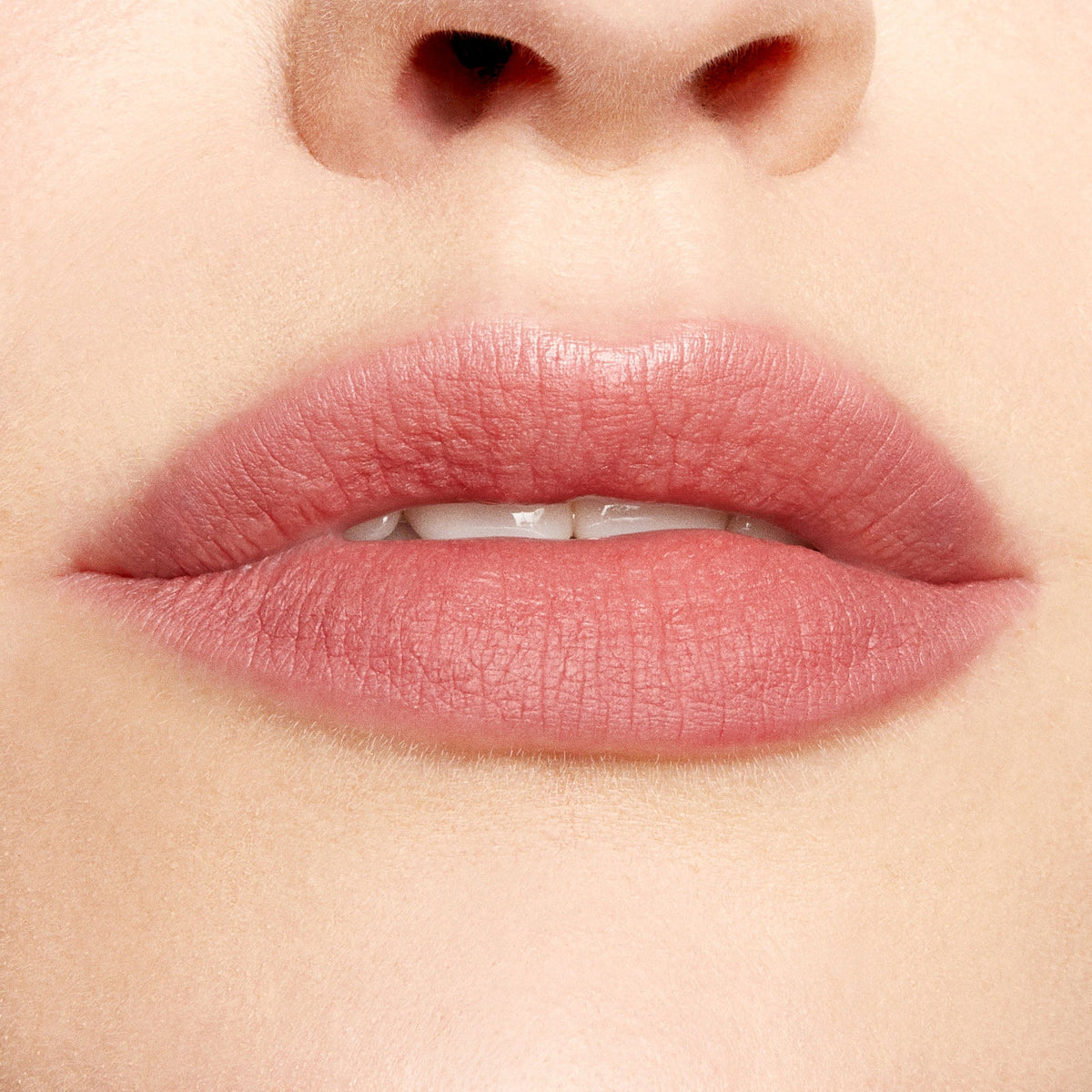 Lips defined and softly filled with Good N Plenty ColourPop Lippie Pencil, a creamy neutral rosy pink lip liner, creating precise matte edges and even color in a clean studio close-up.