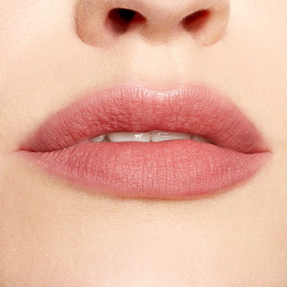 Lips defined and softly filled with Good N Plenty ColourPop Lippie Pencil, a creamy neutral rosy pink lip liner, creating precise matte edges and even color in a clean studio close-up.