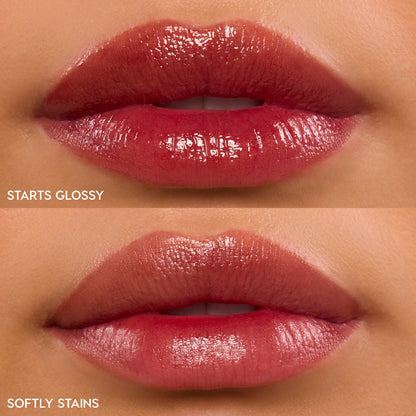 Lips wearing ColourPop Lip Stain (Hydra Pop) in 90s Babe show a stacked comparison: top glossy with rich rosy berry shine, bottom stain with a softer sheer tint; close-up labels read Glossy and Stain for finish reference.