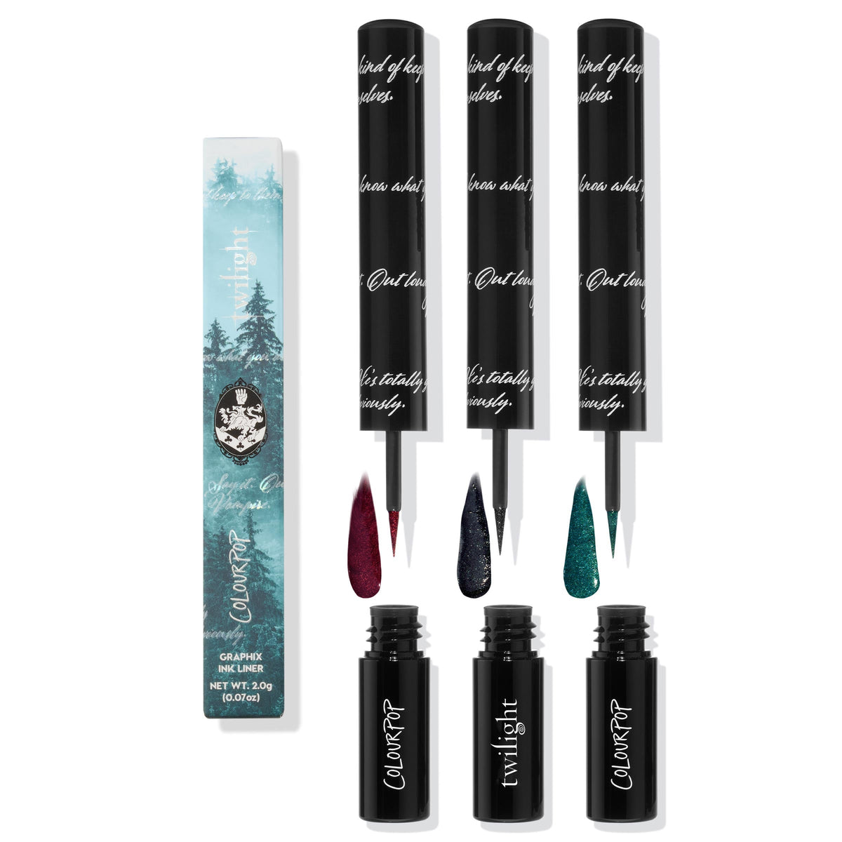ColourPop Graphix Ink Liner I Know What You Are bundle shows three liquid liners with fine brush tips and swatches - shimmering burgundy, midnight navy, and deep teal - set beside Twilight forest-print packaging and sleek black barrels.