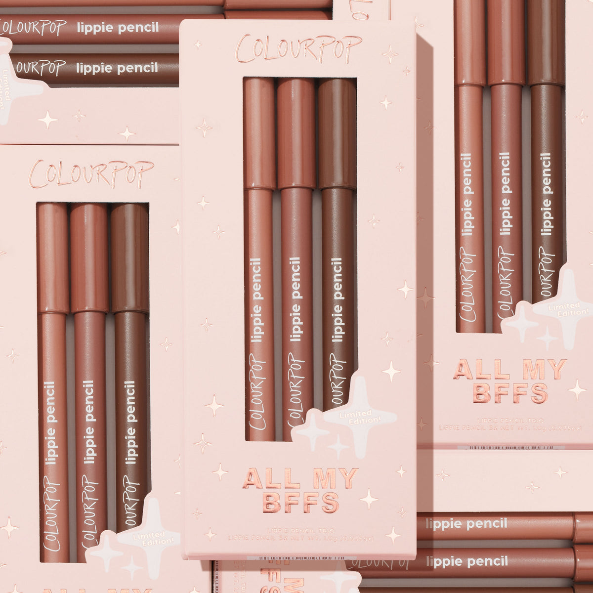 All My BFFs ColourPop Lippie Pencil set displayed in a top-down flat lay, three lip liners in nude, rose, and deep brown in blush-pink, star-embossed limited-edition boxes, highlighting the logo and shade range for precise lip definition.