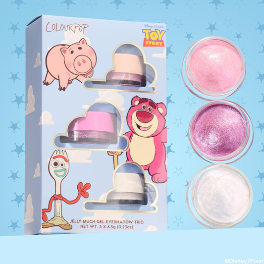 ColourPop Jelly Much Shadow Play All Day trio showcasing three shimmery gel eyeshadows - pearl pink, vibrant magenta, and icy white - lined in open pots beside a Disney Pixar Toy Story sky-blue box with Hamm, Lotso, and Forky; set includes 3 x 6.5g jars.