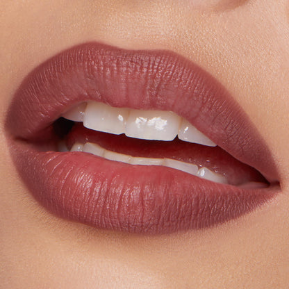 ColourPop Lippie Pencil Double Tap lining softly parted lips, delivering a matte rosy-mauve outline and fill with precise edges; close-up beauty shot on natural skin in studio lighting.