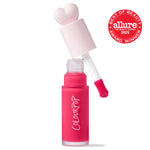 ColourPop Liquid Blush in Wildest Dreams, cap off - heart-shaped pale pink cap and doe-foot applicator hovering over a frosted hot pink bottle, with an Allure Best of Beauty 2025 award badge on the right against a white background.