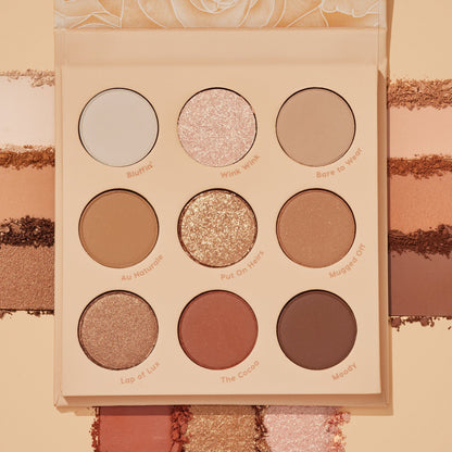 ColourPop Blushing Nude shadow palette set opens to nine neutral pans - matte and shimmer shades like Bluffin’, Wink Wink, and The Cocoa - shown with coordinating swatches surrounding the compact in warm beige, rose, and cocoa tones.