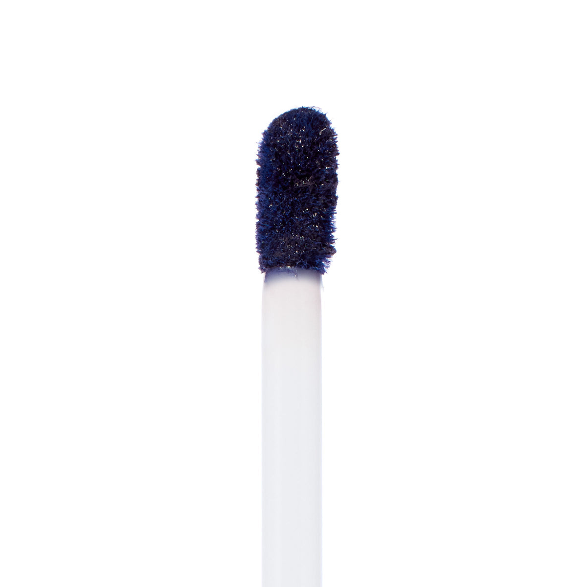 Doe-foot applicator coated in Panther, a deep midnight navy ColourPop Ultra Matte Lip, showcasing the velvety matte formula on a white wand against a clean white background.
