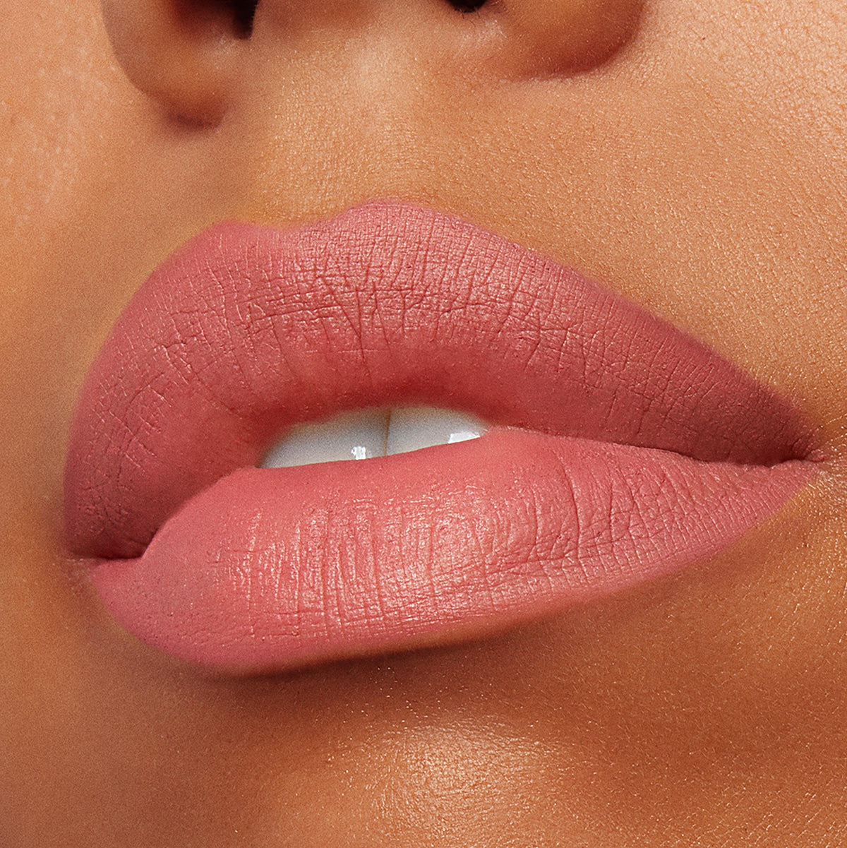 Lips wearing Good N Plenty, a warm rosy nude, lined and filled with ColourPop Lippie Pencil, showcasing a smooth matte finish and crisp edges in a tight close-up beauty shot.