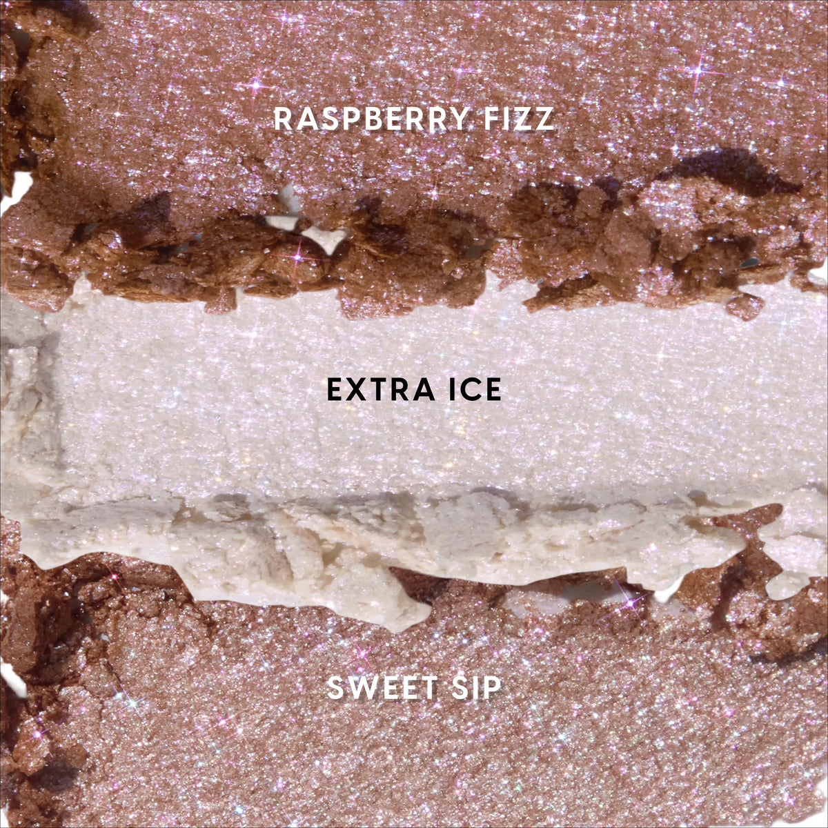 Coconut Cream and Soda Super Shock Shadow swatches showing three ultra-glittery shades—Raspberry Fizz rose bronze, Extra Ice icy champagne, and Sweet Sip warm pink—smeared in textured stripes against a close-up studio backdrop.