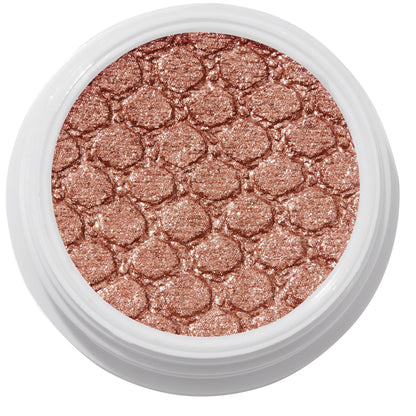 ColourPop Sequin Super Shock Shadow shimmers in metallic copper rose-gold as it catches light, pressed with a scale-embossed texture in a white round pot, shown in a clean studio overhead close-up.