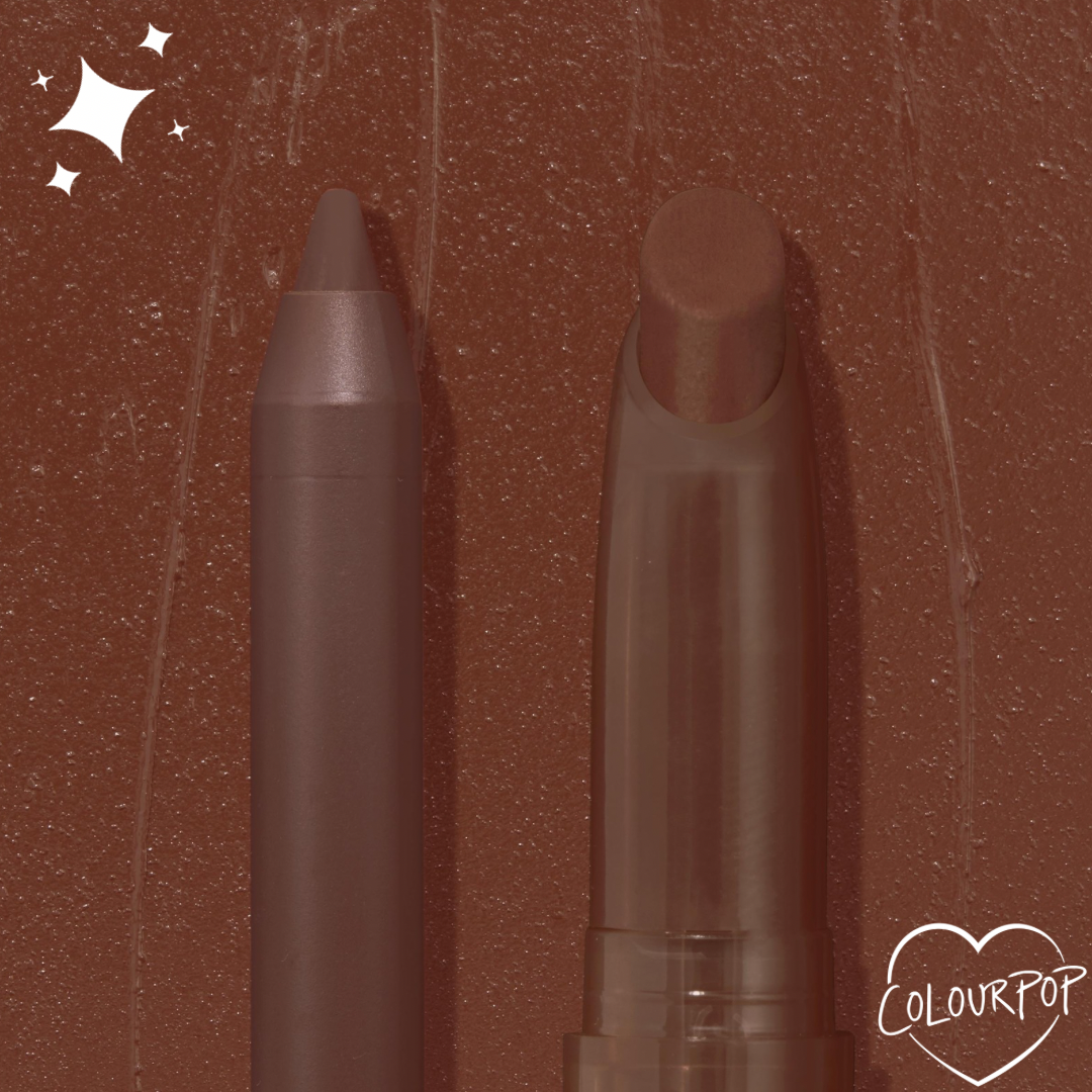 ColourPop Lippie Pencil in Pitch stands upright with a sharpened tip, paired with a matching lip crayon on a smeared chocolate-brown backdrop featuring a small ColourPop heart logo, highlighting the deep brown shade.