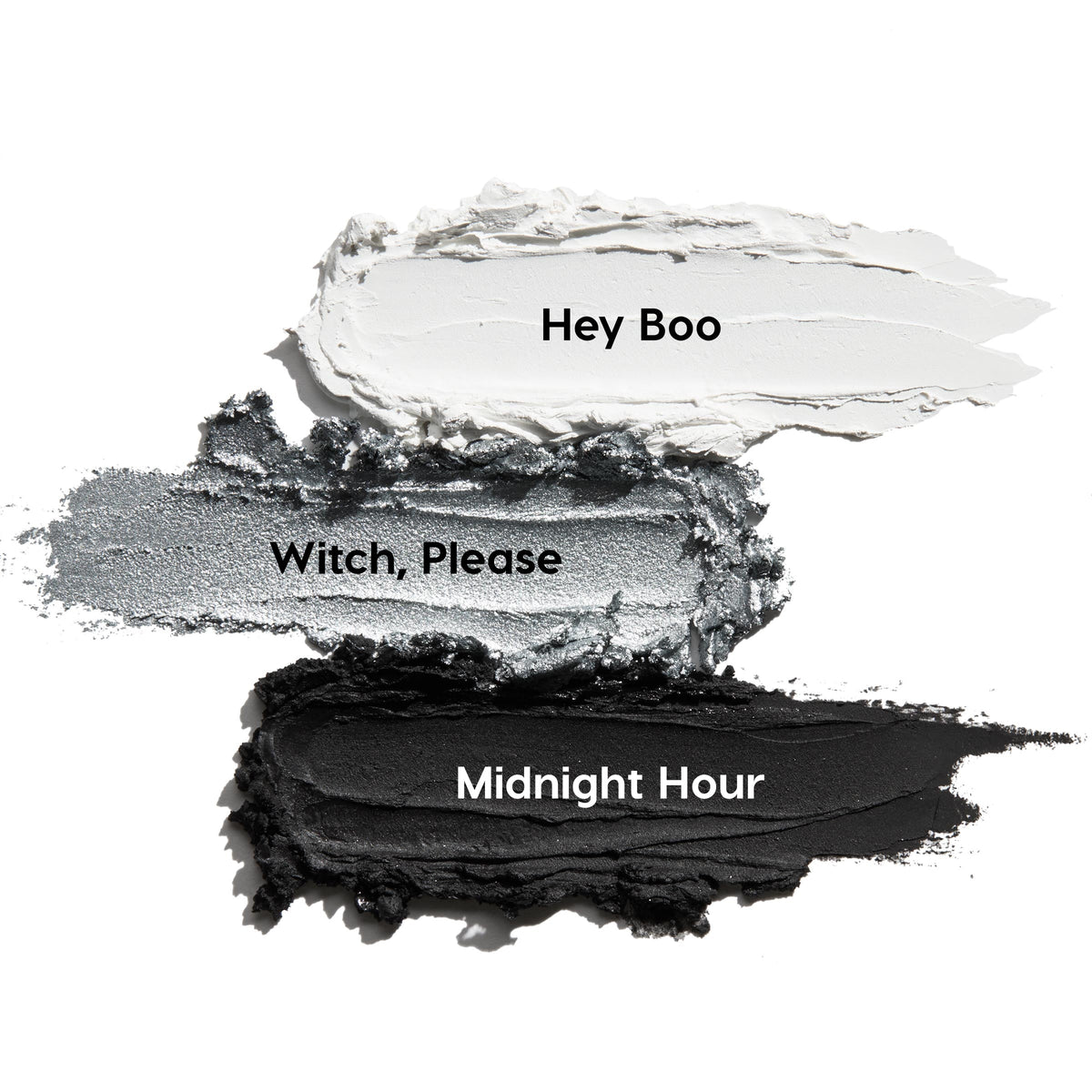 Totally Wicked ColourPop Shadow Stix trio swatches streak across a white backdrop - matte white Hey Boo, metallic silver Witch, Please, and matte black Midnight Hour - showcasing creamy, blendable eye color.