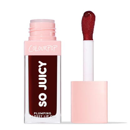 ColourPop So Juicy Plumping Glossy Lip Oil in Beverly Drive stands with cap off, showing a doe-foot applicator loaded with deep burgundy gloss; clear rectangular tube with pink cap and SO JUICY branding on a clean white background.