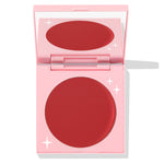 TTYL ColourPop Cream Blush compact revealing a matte deep coral-red pan and mirror, shown half-open in a pastel pink case with white star accents on a clean white background.