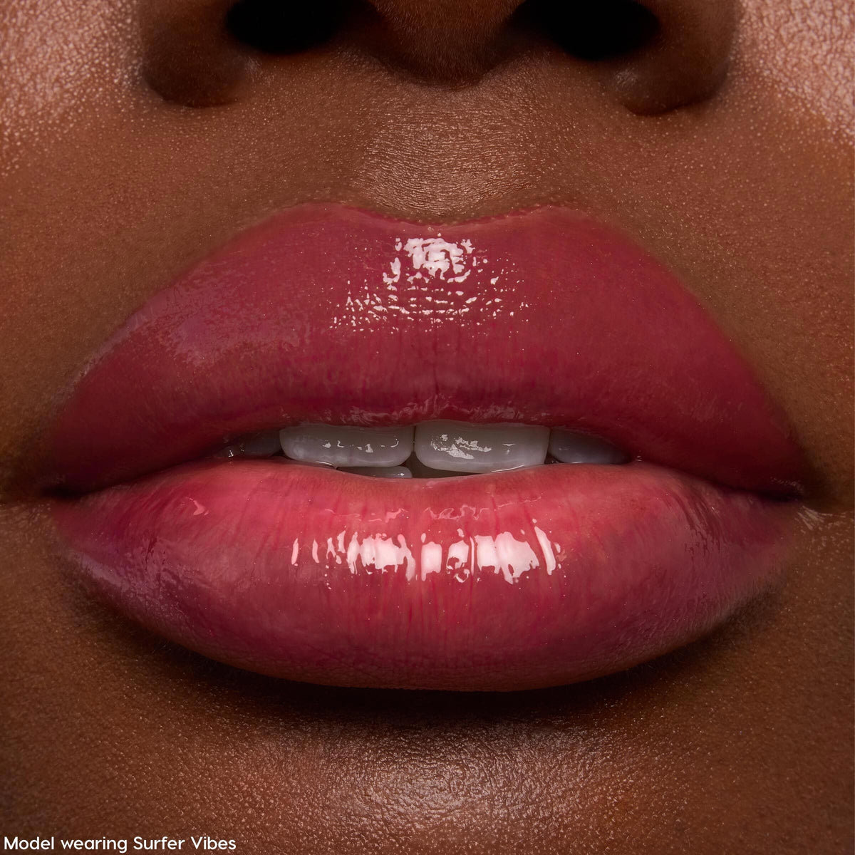 Glossy lips wearing ColourPop Ultra Glossy Lip, Keepin’ It Sweet - sheer rose-pink shine applied evenly with a glassy, reflective finish; extreme close-up showcases hydrated texture and subtle tint on natural lips.