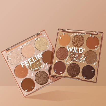 Two ColourPop 9-pan eyeshadow palettes - Feelin’ Toasty and Wild Child - fan open to reveal warm brown and bronze mattes and shimmers on a tan backdrop; Feelin Wild Shadow Palette Set, a ColourPop Shadow Palette Set for neutral glam looks.