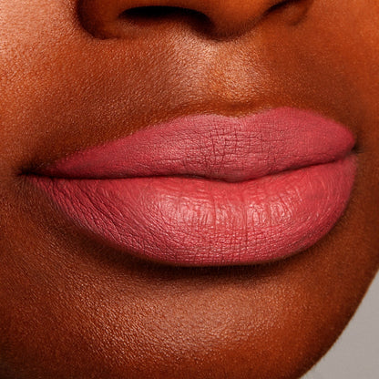 Lips wearing Bumble Lippie Pencil, precisely lined and filled in a smooth, matte dusty-rose hue, shown in a close-up swatch of the ColourPop Lippie Pencil for shoppers viewing shade payoff and texture.