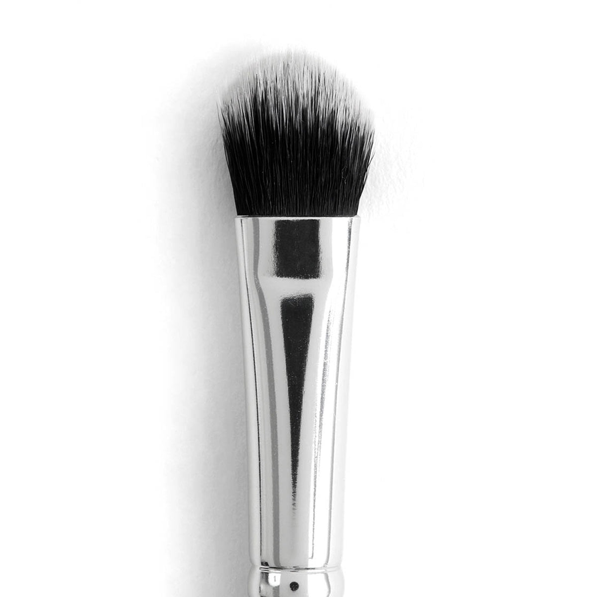 ColourPop Large Shader Brush makeup brush featuring dense, rounded black‑to‑white duo-fiber bristles and a polished silver ferrule, designed to pack and blend eyeshadow on lids, shown close-up on a white background.